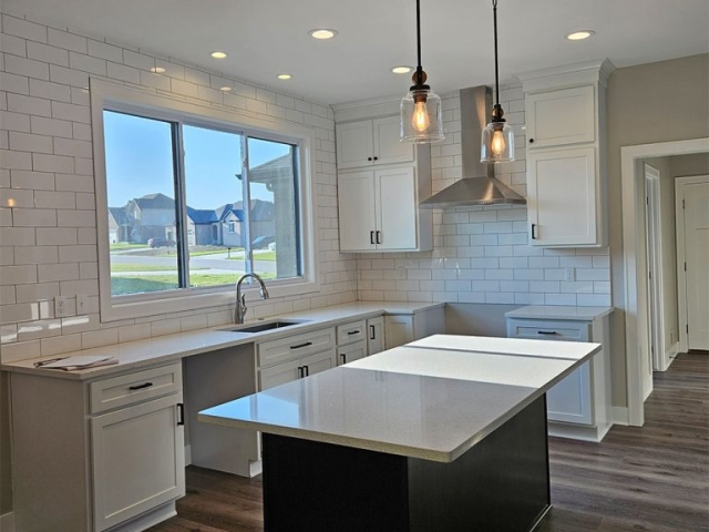 RPEN 22 Kitchen with white cabinets and black island