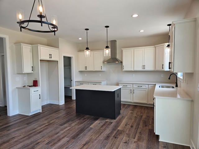 RPEN 4 Kitchen with white cabinets and black island