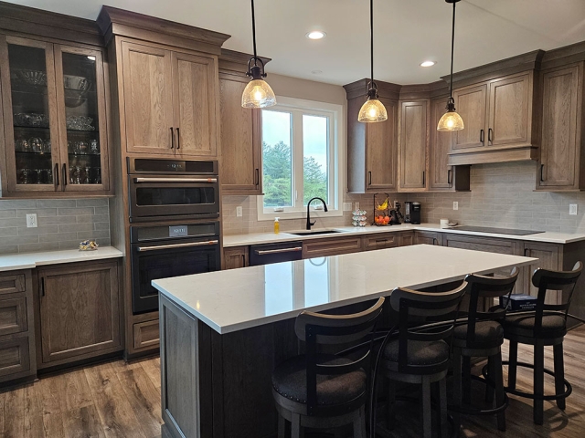 Riley Kitchen with stained wood cabinets and white countertops